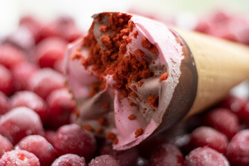cherry ice cream cone on cherry background