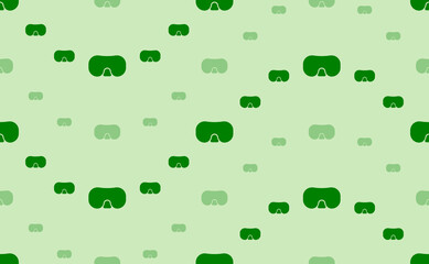 Seamless pattern of large and small green diving goggles symbols. The elements are arranged in a wavy. Vector illustration on light green background