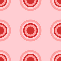 Seamless pattern of large isolated red radio button symbols. The elements are evenly spaced. Vector illustration on light red background