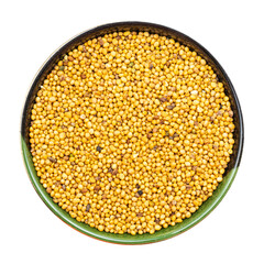 yellow seeds of mustard in round bowl isolated