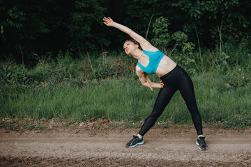 Sporty fit woman doing morning workout outdoors