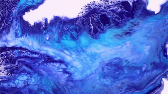 Fluid art drawing footage, modern acryl texture with colorful waves. Liquid paint mixing artwork with splash and swirl. Detailed background motion with navy blue, blue and white overflowing colors.