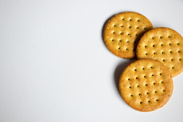A close up of appetizer crackers on a white background.