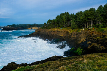 Fototapeta na wymiar Ocean waves crashing,Rocky coast and beach with ocean surf, Oregon Coast, USA