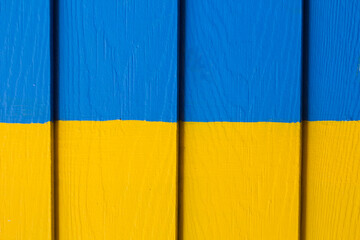 Yellow and blue color wooden wall.