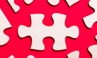 On a bright red background, white puzzles. One of the puzzle pieces has a place to insert text. Template