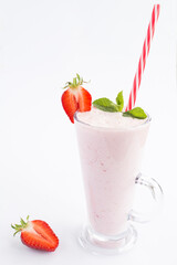 Strawberry milkshake in the drinking  glass on the white background. Location vertical.