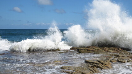 Wave burst on rocks