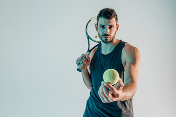 Tennis player hold racquet and show ball in hand - Powered by Adobe