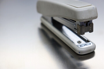 opened stapler machine on the table