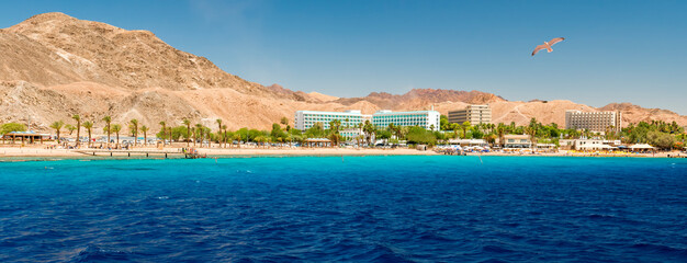 Panoramic view on sandy beach and hotels for divers and vacationers, the area located near coral...