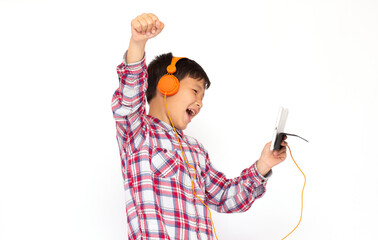 Studio shot of teenager listening to music at headphones and screaming while looking at a tablet, isolated over white background