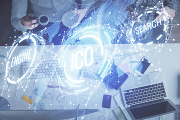 Double exposure of man and woman working together and crypto theme hologram drawing. Computer background. Blockchain concept. Top View.