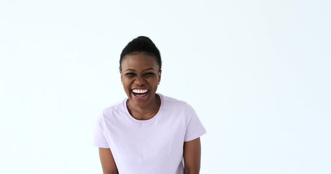 Woman laughing out loud over white background