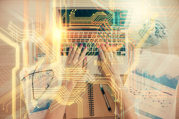 Double exposure of woman hands working on computer and world map hologram drawing. Top View. International business concept.