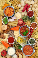 Italian & Mediterranean food ingredients for balanced nutrition high in antioxidants, anthocyanins, fibre, lycopene, omega 3 & protein. Flat lay, top view.