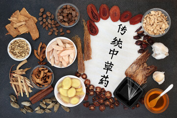 Chinese acupuncture needles and  herbs to treat colds and flu virus with calligraphy script. Used to treat fever, coughs and lung disease. Translation reads as traditional chinese herbs for healing.