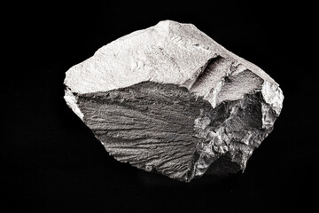 Iron mineral isolated on black background, concept of mining and stone for industrial use.