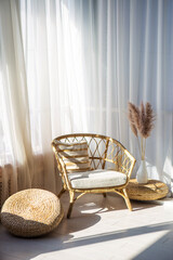wicker chair in the interior by the window