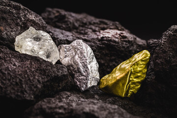 nugget of silver and gold stone and rough diamond, in mine, concept of precious stone mining or...