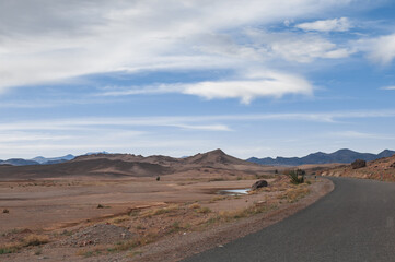 Fototapeta na wymiar desert and magnificent Atlas mountains landscape graphic layers of rock form seductive curves