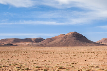 Fototapeta na wymiar desert and magnificent Atlas mountains landscape graphic layers of rock form seductive curves