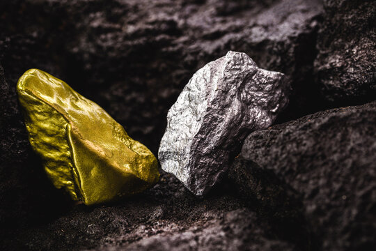silver nugget and gold stone in mine, concept of rare stone mining or mineral extraction