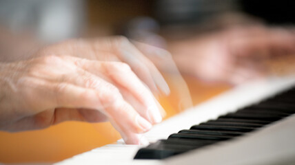 Fototapeta premium Male fingers playing the electric piano, multi-exposure