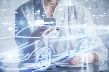 Double exposure of automobile icon hologram and woman holding and using a mobile device. Technology...