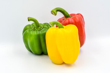 Fresh sweet pepper (red , yellow, and green) on white background