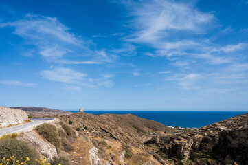 Fototapeta na wymiar Scenic landscape of mountainous terrain on Santorini island, Greece. Aegean sea. Blue sky. Tourism in Europe.