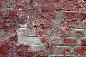 Red brick wall. Background with a brickwork texture. The walls of street houses. Loft style.
