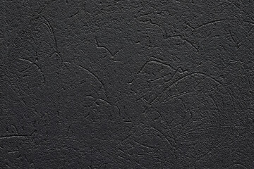 Black texture background. Concrete wall. Rough surface. Stone texture. Uneven, scratched, lumpy.