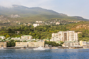 A complex of hotels on the shore.