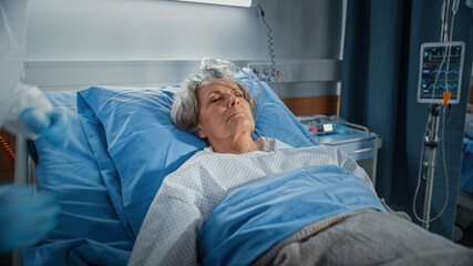 Hospital Ward: Portrait of Beautiful Elderly Woman Sleeping in Bed, Fully Recovering after Sickness...