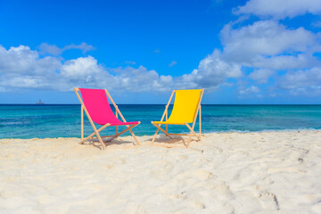 Beach chairs on the shoreline, beautiful beach