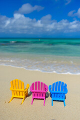 Colorful beach chairs on the shoreline, beach in Aruba