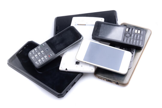 Pile of mobile phone on white background, Reuse and Recycle concept