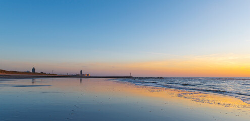 Oostende (Ostend) beach panorama at sunset by the North Sea with skyline, West Flanders, Belgium.