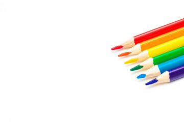 crayons concept in close-up of various colors, rainbow color selection, equality or LGBT gay pride flag or beautiful life concept on white background