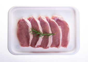 Raw pork meat in tray on white background