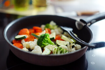 Fresh vegetables cooking on pan at home