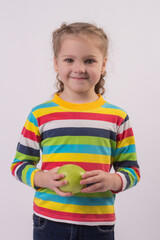 blonde girl with pigtails drinks water from a plastic bottle