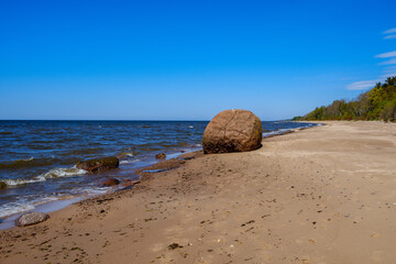 baltic sea beach with white sand and large rocks