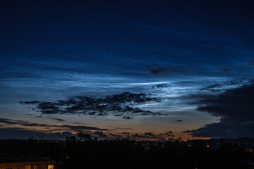 dark colorful sunset over city rooftops