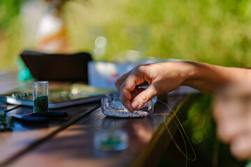 woman artist hands making handmade jewelry