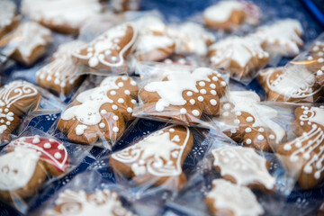 Lots of Christmas hand-made and decorated honeycombs. Ready for sale on the market in the store on the table.