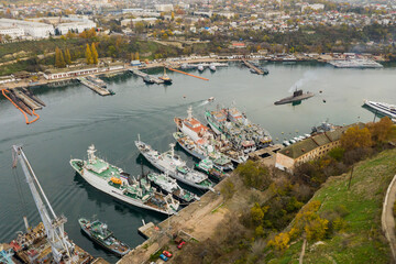 Bay with ships in the city. South Bay in Sevastopol with civilian and military ships. The submarine in the bay is preparing for mooring.
