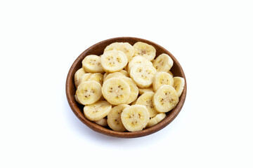 Banana slices in wooden bowl on white background.