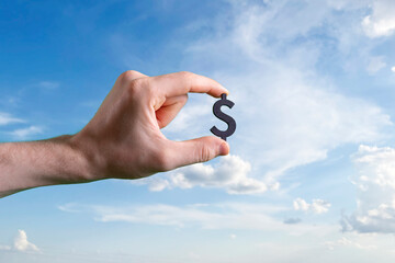 hands holding a dollar sign, rich and finance success of business concept